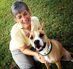 Woman with a dog in the grass